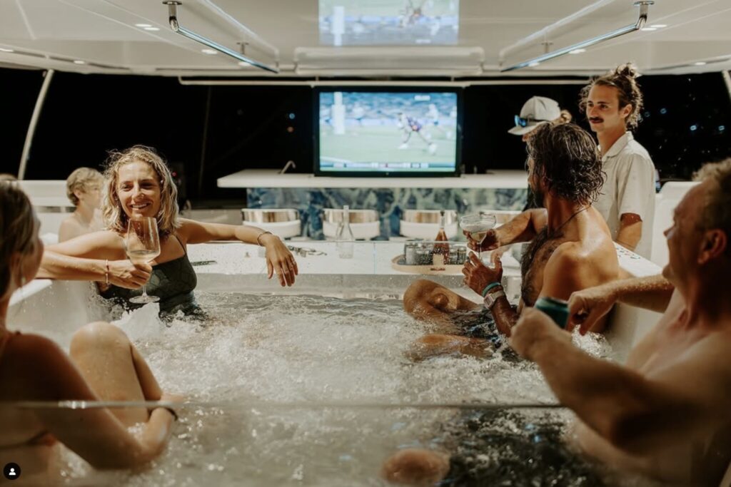 Charter Catamaran Ohana, guests enjoying the hot tub