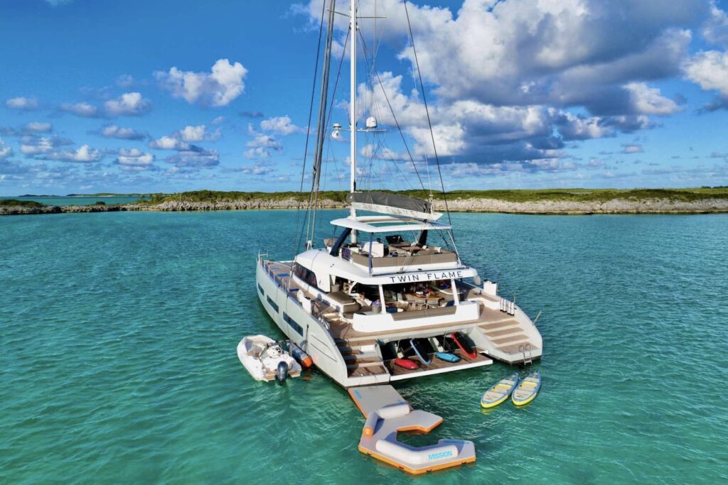 TWIN FLAME, a Lagoon Seventy 7 sailing catamaran, at anchor in the BVI with the paddleboards and floating platform out
