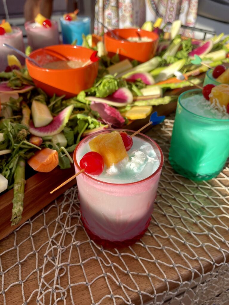 Cocktails and canapes laid out on a crewed catamaran in the BVI, from our fam trip