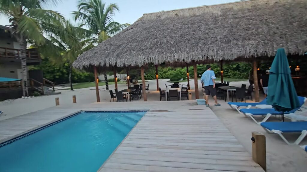 The pool and palapa bar at Anegada Beach Club at dusk, November 2025
