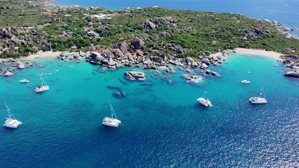Catamarans anchored along the point at The Baths, Virgin Gorda