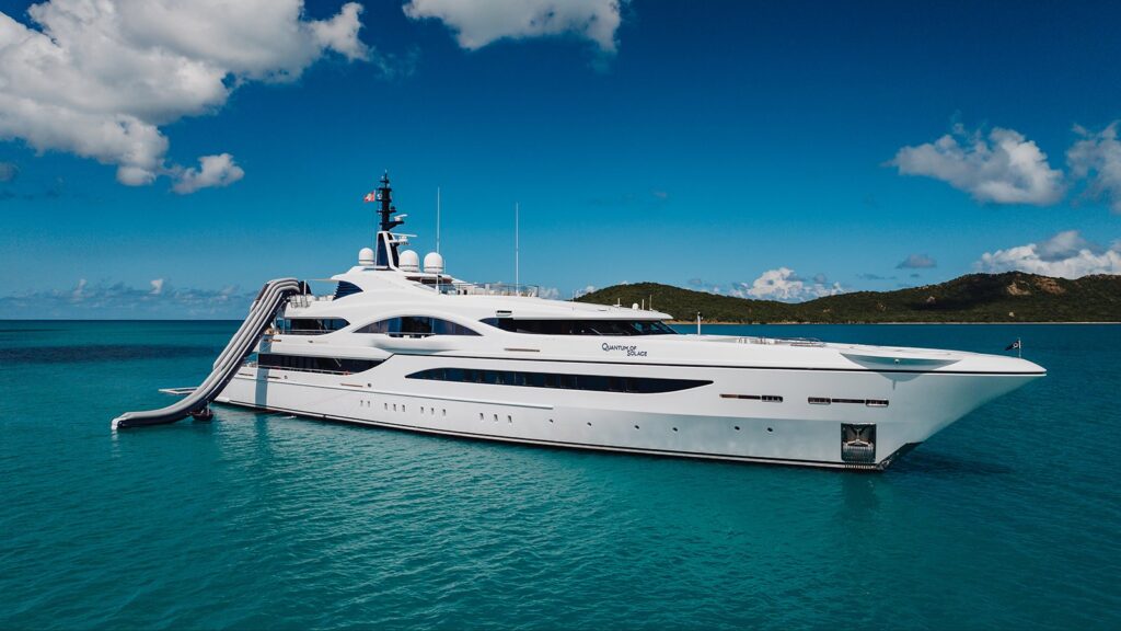QUANTUM OF SOLACE superyacht at anchor with her water slide out