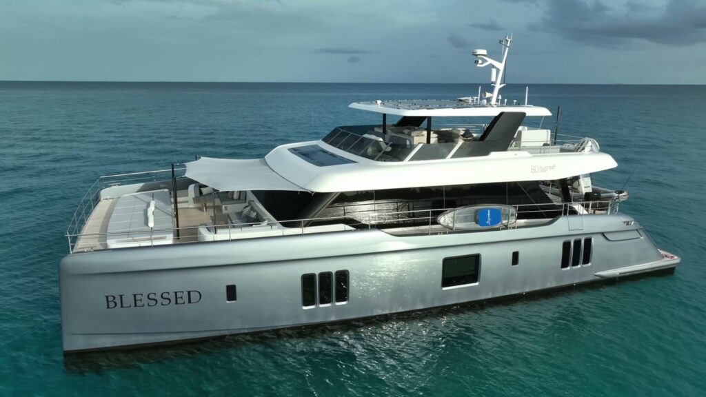 BLESSED, a Sunreef 80 power catamaran, at anchor in turquoise water