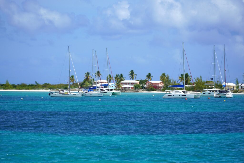 Catamarans moored in turquoise water off Anegada, British Virgin Islands