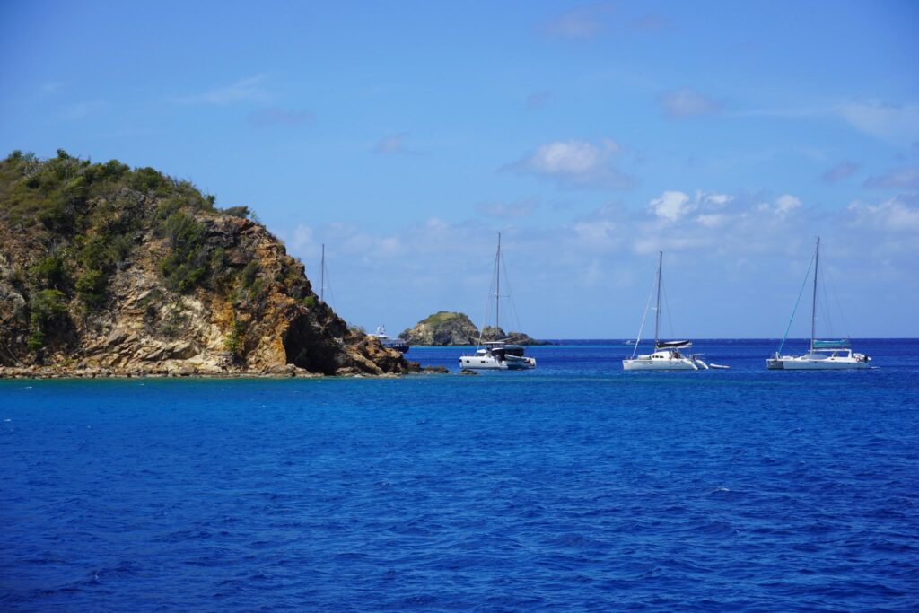 Boats moored at the caves on Norman Island, British Virgin Islands