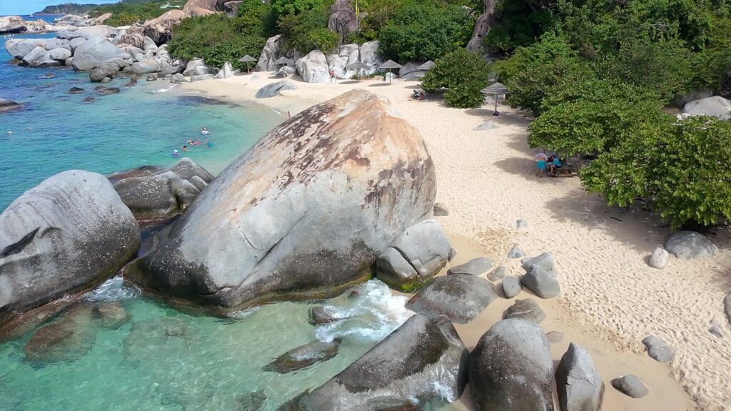 The Baths beach on Virgin Gorda from the air, granite boulders and the swim-in line, November 2025