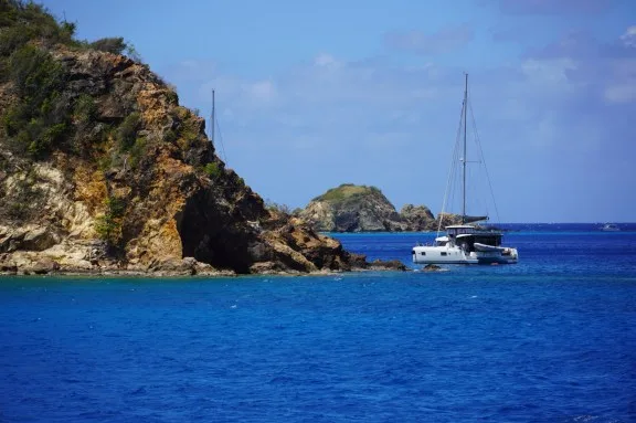 Boats moored at The Caves of Norman Island for snorkelling