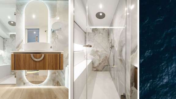 Onboard Catamaran Ohana: Primary Head: Waterfall Shower, Full-Size Toilet, Spacious Storage