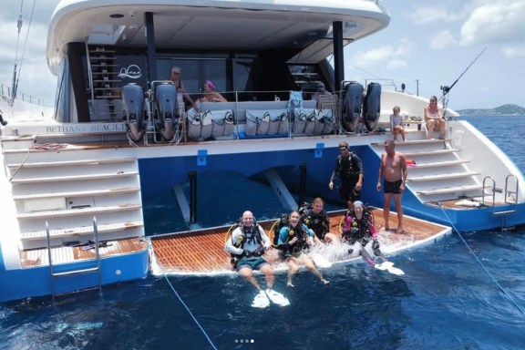 Catamaran Ohana with Scuba divers ready on the aft deck