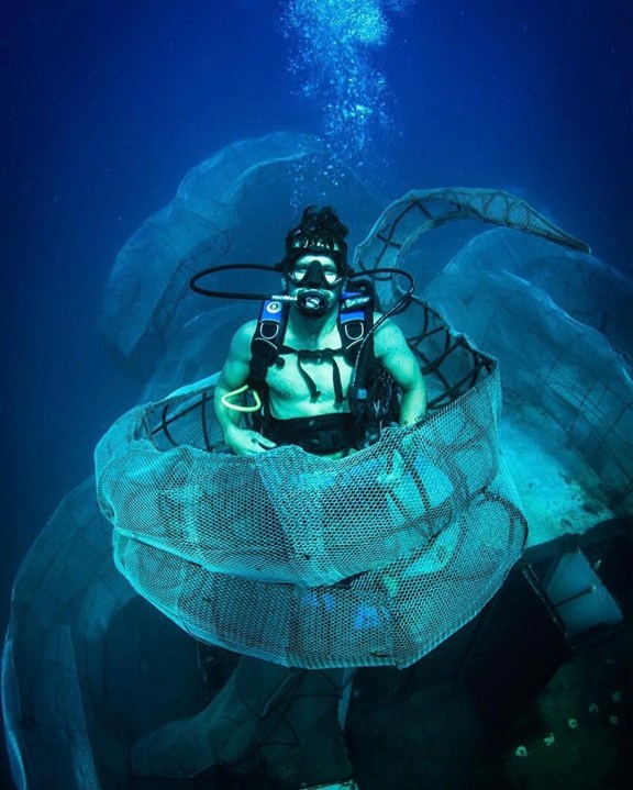 Scuba Diver in the tentitcles of the Kraken on the Kodiac Queen Wreck built by Aydika James and Mike Cline and their engineering team.