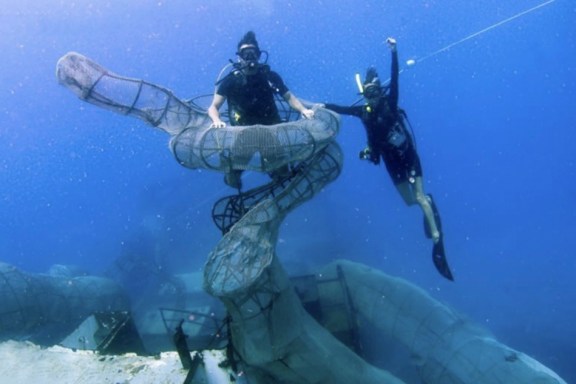 Scuba Diver in the tentitcles of the Kraken on the Kodiac Queen Wreck built by Aydika James and Mike Cline and their engineering team.