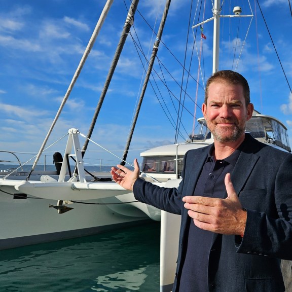 Charter Broker John Boullin presenting catamaran Lagoon 620 at the yacht show.