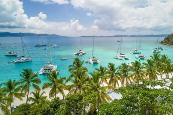 Charter catamarans anchored in front of Soggy Dollar Bar