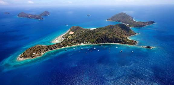 Aerial shot of Cooper Island and the Catamarans anchored in front of Cooper Island Beach Club, BVI