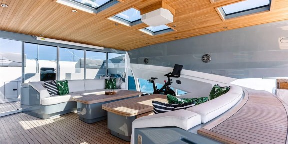 NORMA JEAN Luxury Charter Yacht Palmer Johnson PJ150 Lower Deck Seating and Gym Area