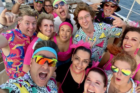 charter guests group photo for themed party