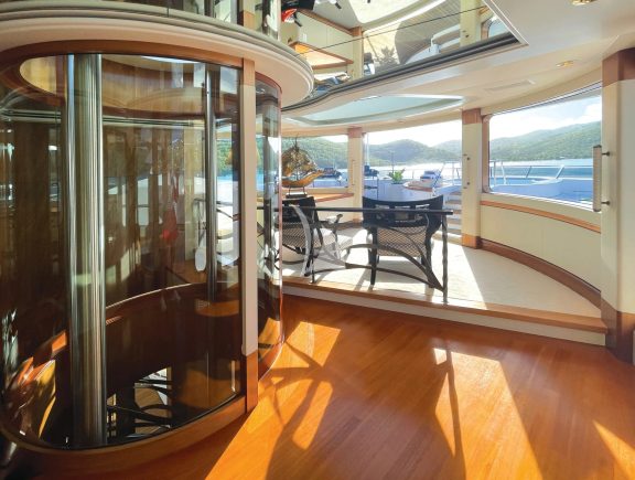 Unique to BLUE MOON is a bespoke glass elevator accessible to all four decks. This customization, along with others including flush thresholds between the interior and exterior decks, grant access to all varieties of mobility.