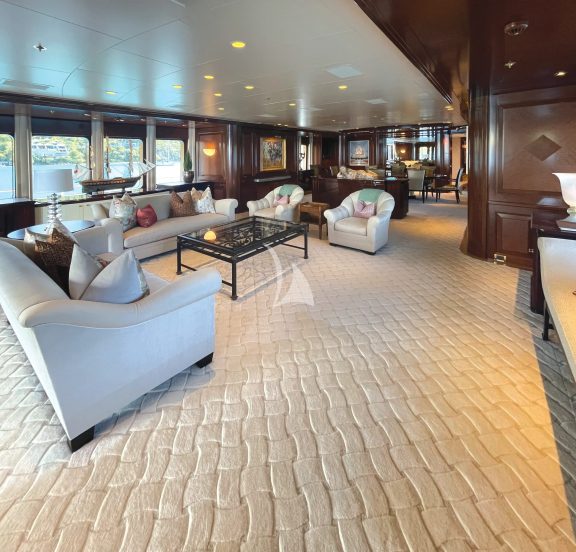 The main deck salon comes equipped with a retractable flatscreen HDTV and large windows for panoramic views.