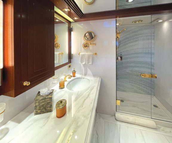 Three of the guest en suite bathrooms feature a spacious stand-up shower with glass enclosure.