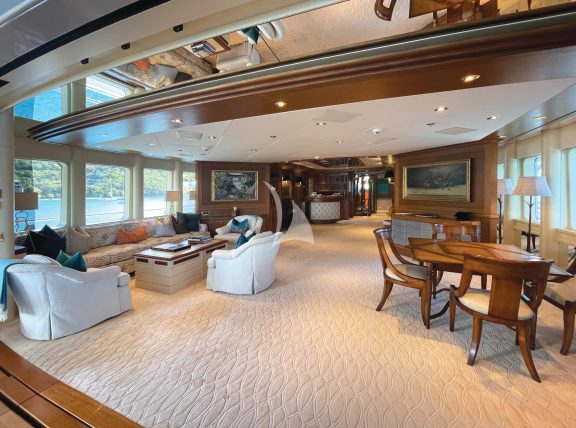 Viewing the Sky Lounge from the Bridge Deck aft dining area; the fully retractable glass manifold expands, seemlessly bringing the outside in.