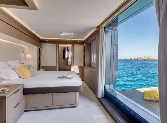 Master cabin with open hull balcony over the water on Lagoon Seventy 7 LA DESIRADE