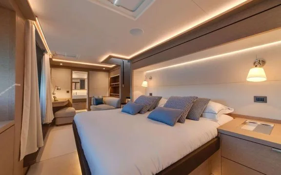 King bed in the forward master cabin on Lagoon Seventy 8 power catamaran ZENIT