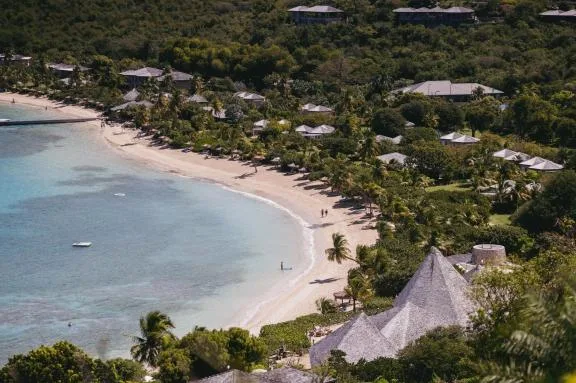 The crescent bay and low-rise cottages of Rosewood Little Dix Bay on Virgin Gorda