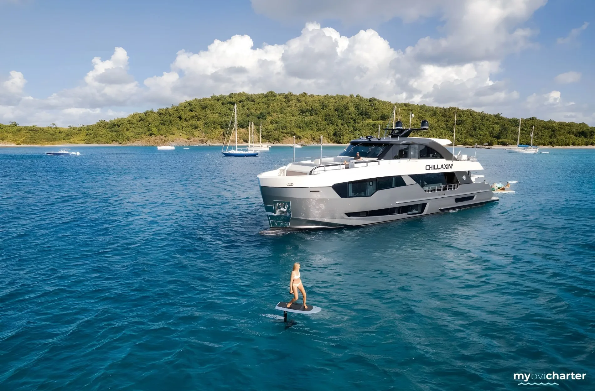 motor yacht chillaxin on anchor in the british virgin islands with guest on an e-foil