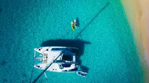 Anchored just off the beach and enjoying the paddle boards
