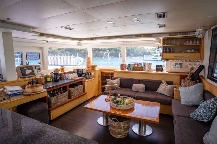 Saloon with updated bar, teak table and seating