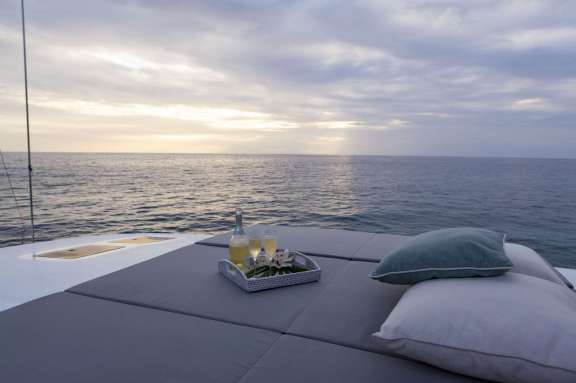 Forward deck lounge area with lots of adjacent space for yoga practice